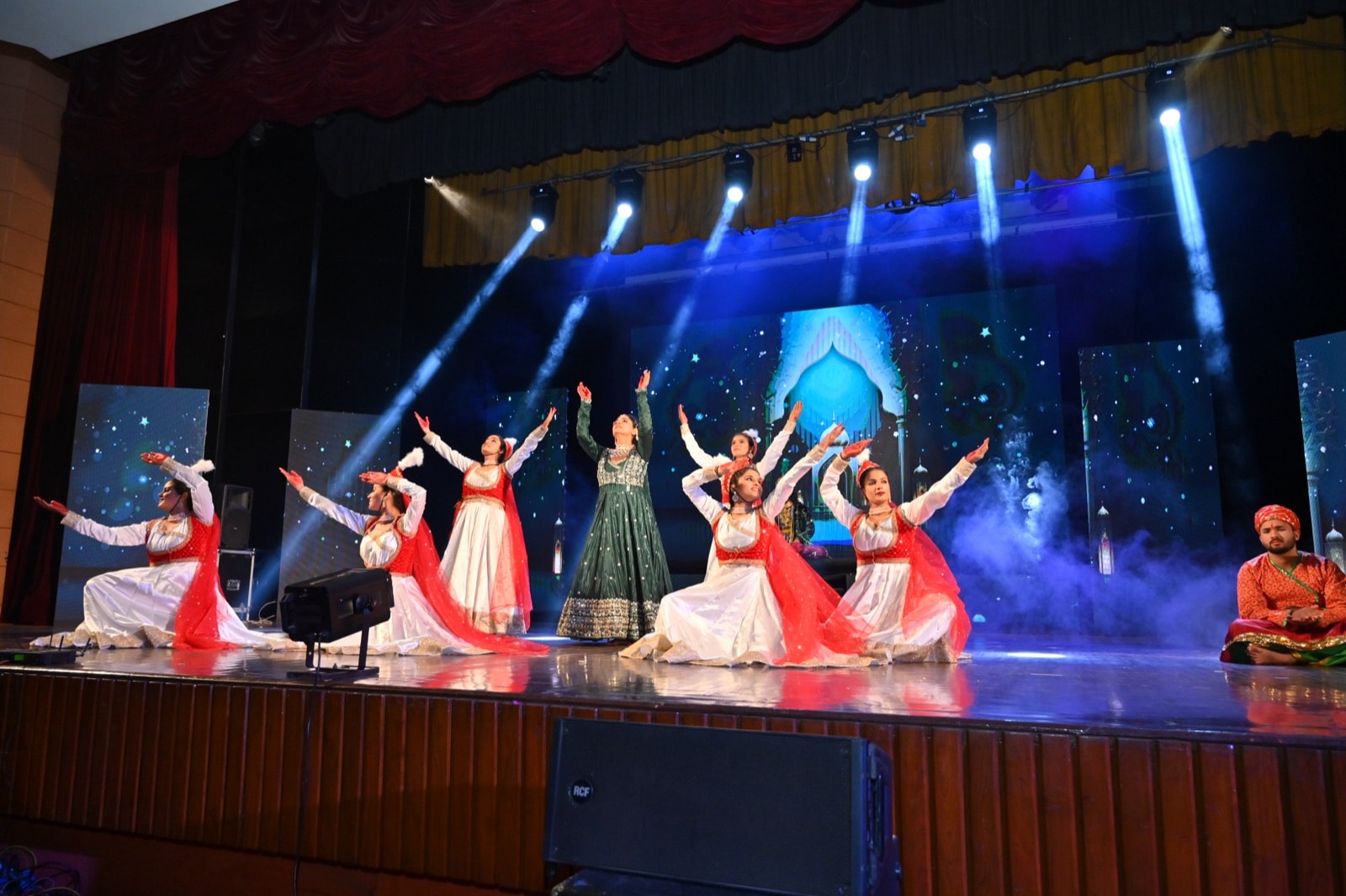 Performers in hand-stitched devotional costumes during a live Bhavya Kavikala performance